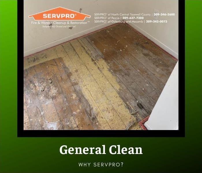 Floor of an empty room is dirty from renovation debris.