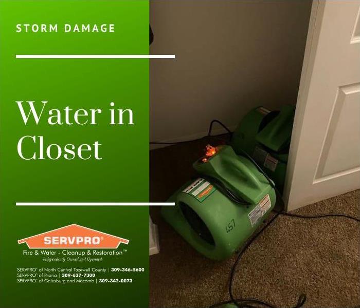 Air movers placed in closet to dry out the walls and the carpet after storm water leaked into the closet.