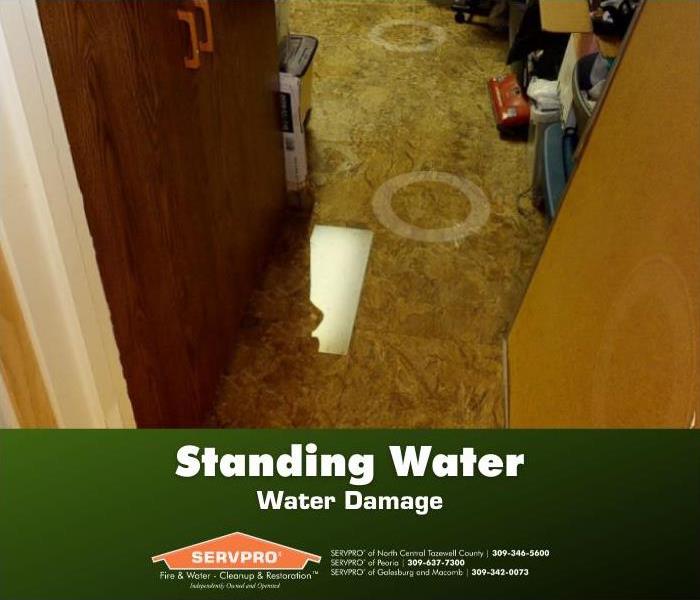 Standing water on tile floor.
