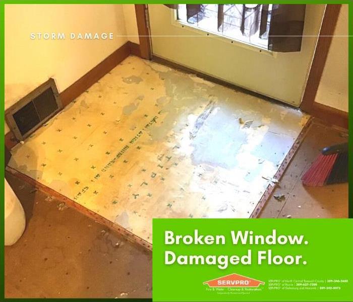 Floor damage resulting from water that came through a broken window